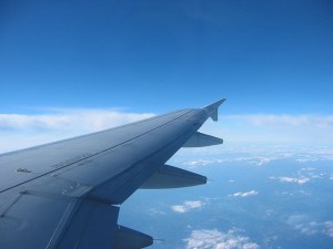 Plane wing over clouds 