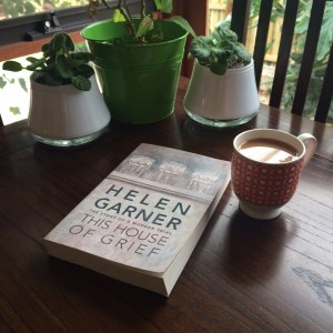 Book with cup of tea and plants