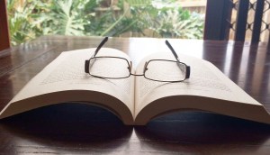 Open book with glasses