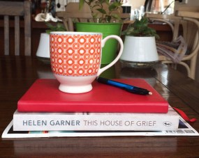 Stack of books and cup of tea